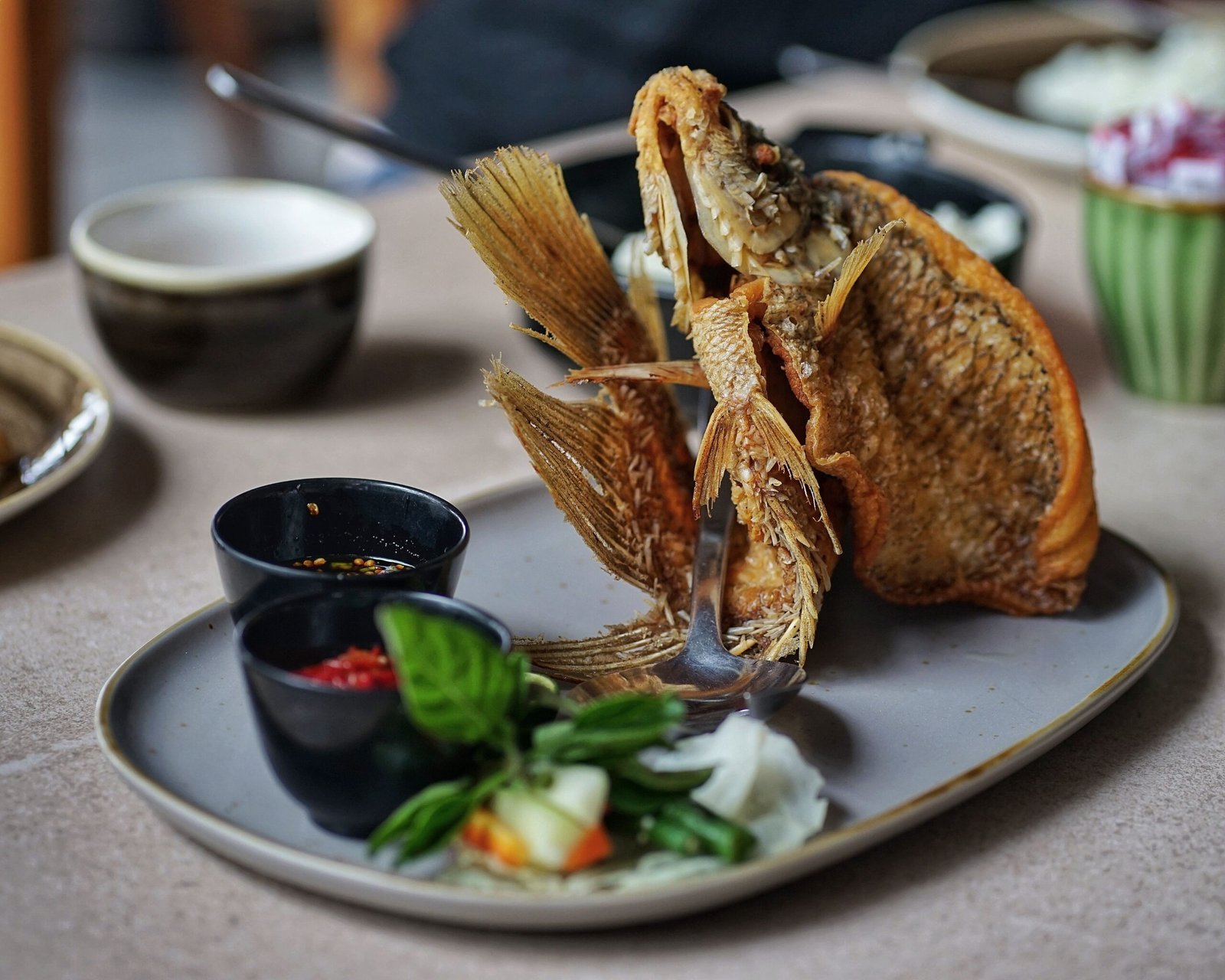 Try seafood and Indonesian classics with a view